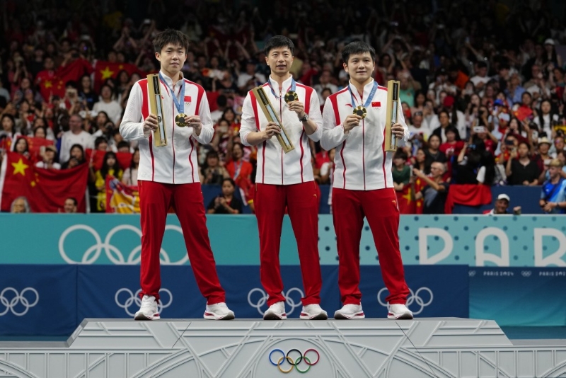 馬龍(中)是「超級全滿貫」男子乒乓運動員，被封「國乒一哥」。AP