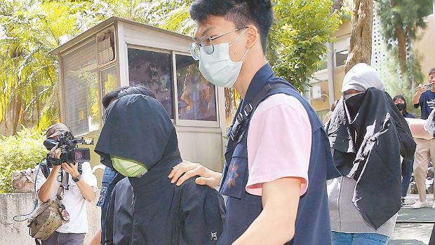 涉嫌恐嚇京華城案檢察官的周姓男子(左)及林姓女子(右)3日落網。